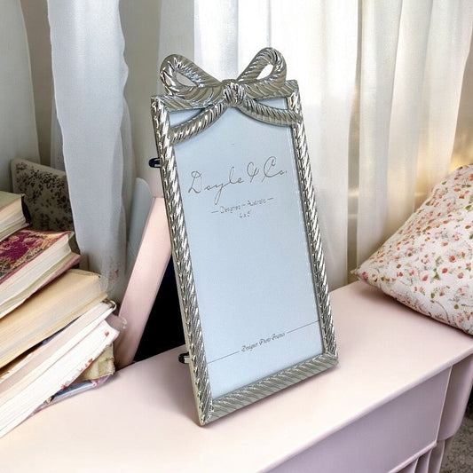 189K Silver Flowing Bow Frame 4X6