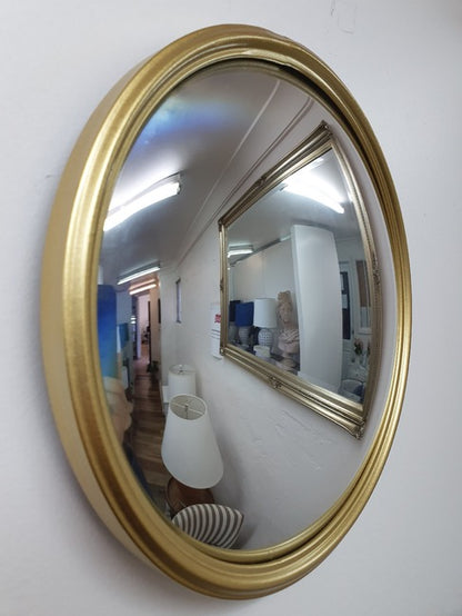 Hannes convex wall mirror with gold frame