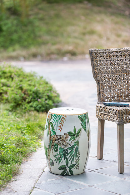 Jungle Themed Ceramic Stool. The Cheetah And Jungle Graphic Play Into The Natural, Bohemian Feel. Used As Either A Stool Or An End Table